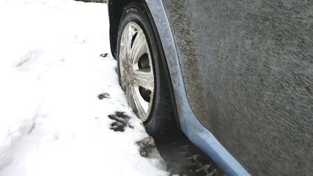 Car wheel in the snow. Tire in the snow. Winter tires.