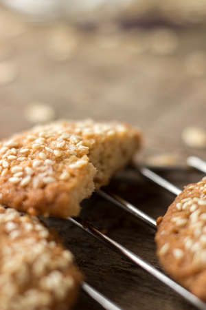 Oatmeal cookies on tray on rustic wooden tableの写真素材
