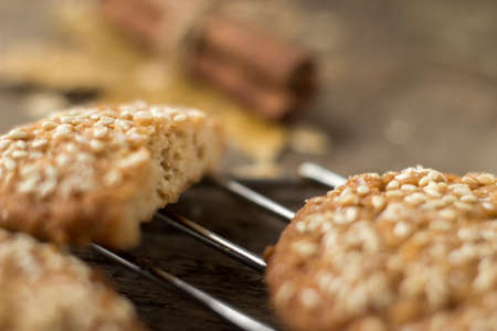 Oatmeal cookies on tray on rustic wooden table, macro.の写真素材