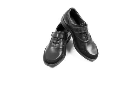 black childrenâs leather shoes with a white background, isolate .の写真素材