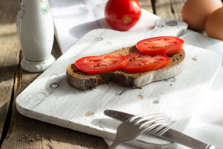 Sourdough toast, with grilled tomatoes. A healthy, delicious breakfast or brunch.の写真素材