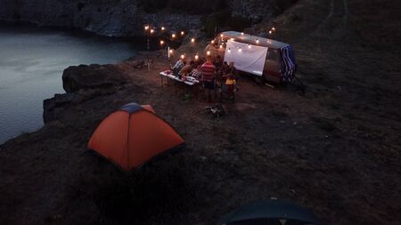 Tourists Frying Marshmallows at Camping Bonfireの写真素材