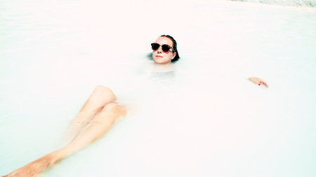 Woman resting in white water in nature