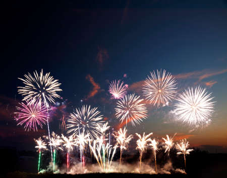 Colorful fireworks of various colors over night skyの写真素材