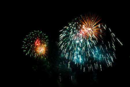 Colorful fireworks of various colors over night skyの写真素材