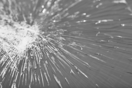 Broken glass - white lines on black background, design element. touch screen smartphone with broken...