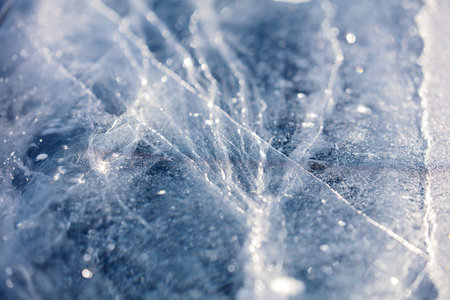 Texture of ice of Baikal lake in Siberia. blue lake ice.