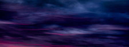 Colorful sunset with clouds in the evening. Abstract nature background. Dramatic and moody pink, purple and blue cloudy sunset skyの写真素材