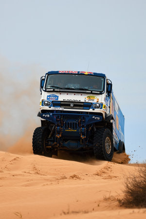 Sports truck KAMAZ gets over the difficult part of the route during the Rally raid in sand. THE GOLD OF KAGAN-2021. 04/26/2021 Astrakhan, Russia.のeditorial素材