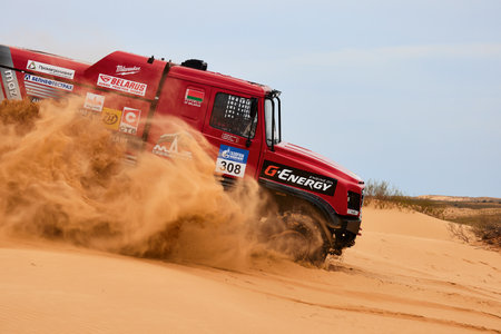Sports truck MAZ Sport-auto team gets over the difficult part of the route during the Rally raid in sand. THE GOLD OF KAGAN-2021. 04/26/2021 Astrakhan, Russia.のeditorial素材