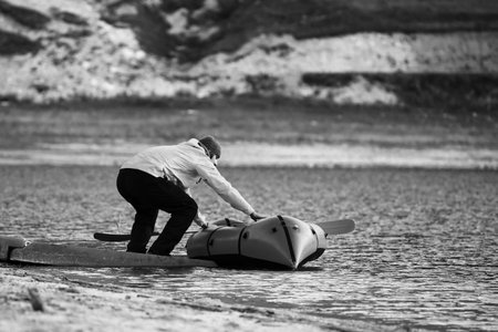 Swim in Packraft. Packraft, one-person light raft used for expedition or adventure racing, on a...