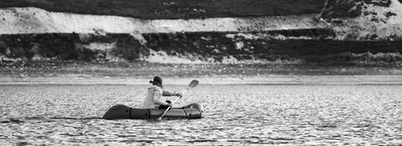 Swim in Packraft. Packraft, one-person light raft used for expedition or adventure racing, on a...