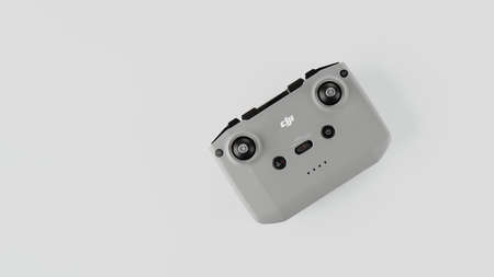 DJI remote control on white background. Control stick of the DJI Mavic 3 drone. Unpacking and configuring the DJI copter. 17.12.2021, Rostov region, Russiaのeditorial素材