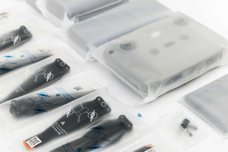 New DJI Mavic 3 drone on a white background when unpacking. Parts of the delivery set in the original packaging. DJI world leader developer and manufacturers in UAV. 17.12.2021, Rostov region, Russiaのeditorial素材