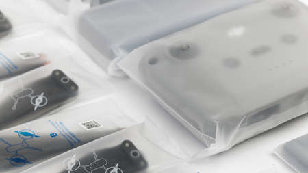 New DJI Mavic 3 drone on a white background when unpacking. Parts of the delivery set in the original packaging. DJI world leader developer and manufacturers in UAV. 17.12.2021, Rostov region, Russiaのeditorial素材