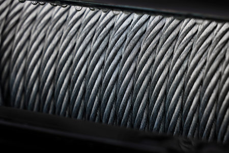 Metal cable winch. Steel rope winch close-up. Strong still background