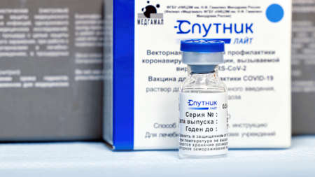 Box and ampoules with new Russian vaccine against coronavirus SARS-CoV-2, Sputnik Lite. Vaccine for prevention COVID-19. 26.08.2021, Moscow, Russiaのeditorial素材