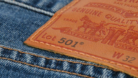 Close up of the details of new LEVIS 501 Jeans. Seams and denim texture close-up. Classic jeans model. LEVIS is a brand name of Levi Strauss and Co, founded in 1853. 31.12.2021, Rostov, Russiaのeditorial素材