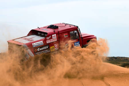Sports truck MAZ Sport-auto team gets over the difficult part of the route during the Rally raid in sand. THE GOLD OF KAGAN-2021. 26.04.2021 Astrakhan, Russiaのeditorial素材