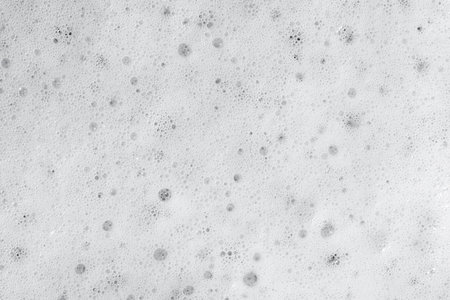 Beer foam top view. Soft fresh Foam on light beer. Bubble froth of beer. Beer foam texture...