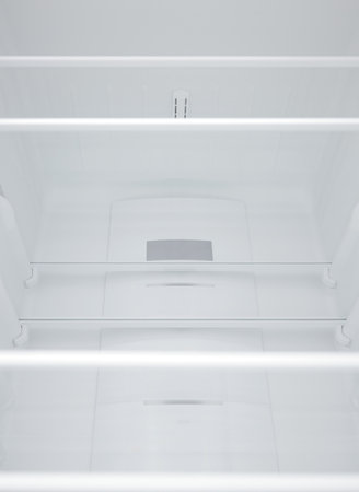 An empty refrigerator. Inside an empty, clean refrigerator, a refrigerator compartment after defrosting. shot with a wide angle lensの写真素材