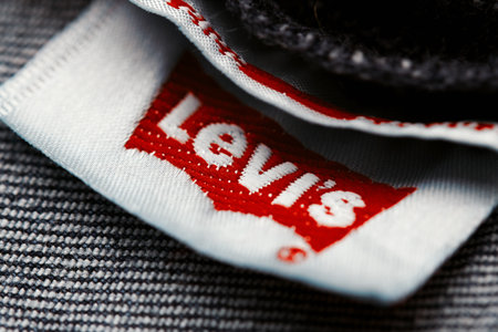 Close up of the of the label of new LEVIS 501 Jeans on the inside. Logo and stamp LEVIS on the underside of the textile. Classic jeans model Levi Strauss. 31.12.2021, Rostov, Russiaのeditorial素材