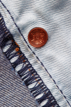 Seams on LEVIS jeans close-up. Stitching on denim on the inside. Fabric texture. Blue jeans background and texture. Denim texture on the underside of the textile. 31.12.2021, Rostov, Russiaのeditorial素材