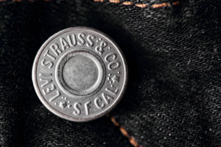 Close up of the details of new LEVIS 501 Jeans. Seams and button fly close-up. Classic jeans model. LEVIS is a brand name of Levi Strauss and Co, founded in 1853. 31.12.2021, Rostov, Russiaのeditorial素材