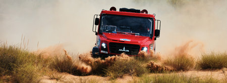 Extreme off-road racing. Sports truck MAZ Sport-auto team gets over the difficult part of the route during the Rally raid in sand. 14.07.2022 Kalmykia, Russiaのeditorial素材