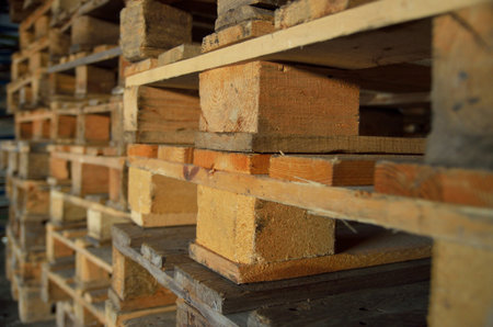 wooden pallets. wood texture. Pallets stacked in piles.