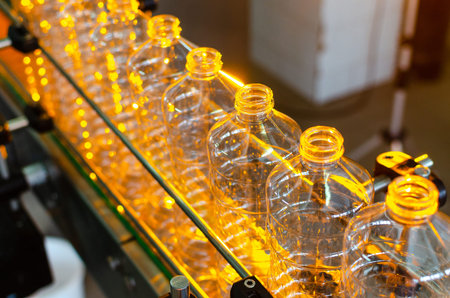 Bottle. Industrial production of plastic pet bottles. Factory line for manufacturing polyethylene...