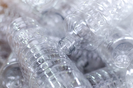 Bottle. Industrial production of plastic pet bottles. Factory line for manufacturing polyethylene bottles. Transparent food packaging.の写真素材