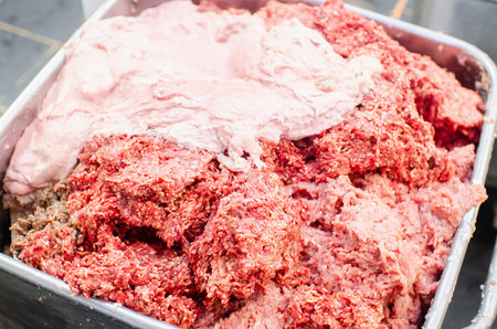 Meat grinder. Sausage production line. Process of sausage manufacturing. Industrial manufacturing of...