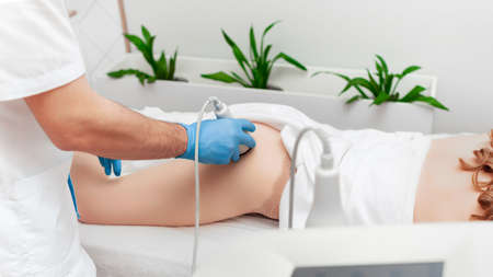 Body shaping and anti-cellulite ultrasound massage. Cosmetology banner copy space.の写真素材
