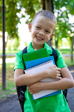 back to school. Portrait of an elementary school student. First grader. The beginning of classes. A...