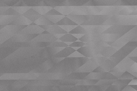 This artwork showcases an intricate geometric pattern with various shades of grey, creating depth and texture. The design is both modern and minimalist, drawing the eye with its captivating shapes.の写真素材