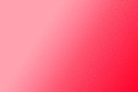 A smooth gradient showcases vibrant shades of red, transitioning seamlessly from a lighter hue to a deeper tone. This colorful display creates an energetic atmosphere.の写真素材