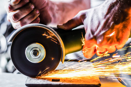 Work in the garage of the angle grinderの写真素材