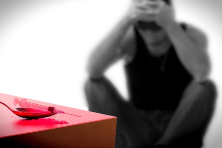 syringe and drug addict, sitting の写真素材