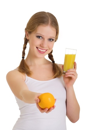 beautiful girl full of life with orange juice isolated on white backgroundの写真素材