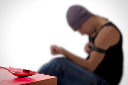 syringe and drug addict, sitting の写真素材