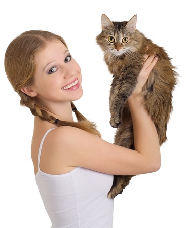 pretty girl with a fluffy cat over whiteの写真素材