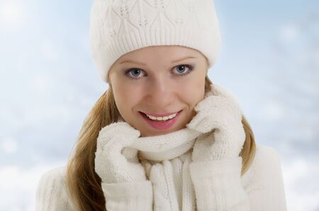 winter portrait of a beautiful happy girl outdoorの写真素材