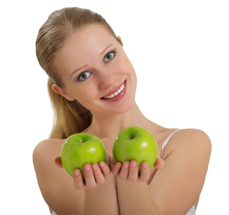 beautiful healthy girl holding two apple  isolated on white backgroundの写真素材