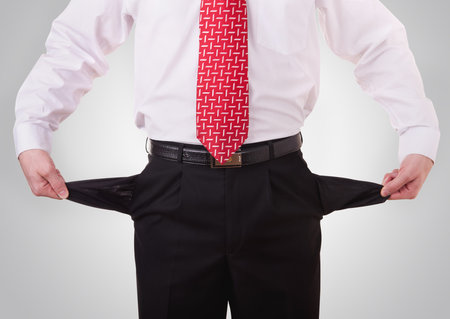 business man showing his empty pockets 
