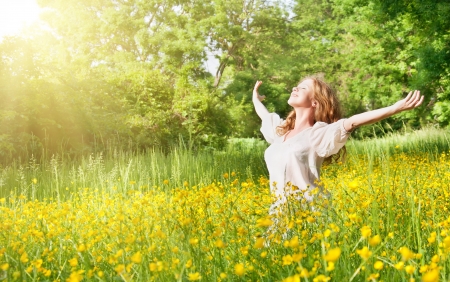 beautiful girl enjoying the summer sun in the parkの写真素材