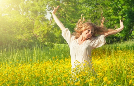 beautiful girl enjoying the summer sun outdoors in the park