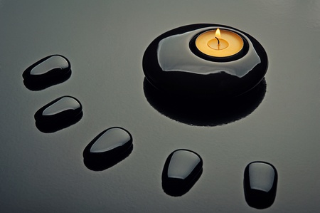 spa composition. black stones and a candleの写真素材