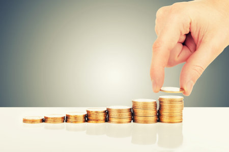 concept of enrichment and financial growth  hand and gold coins
