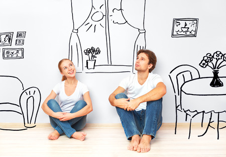 Concept family: Happy couple in the new apartment dream and plan interiorの写真素材